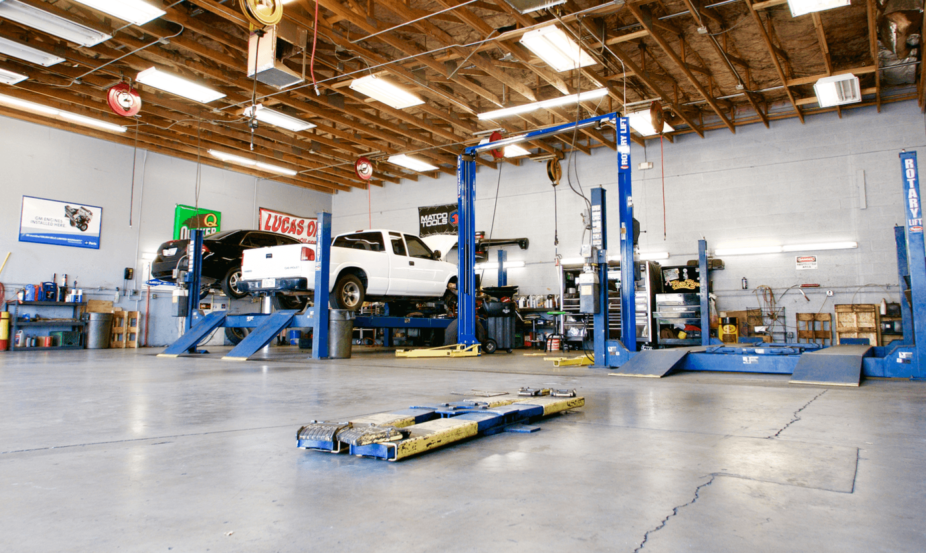 Kobar's Auto shop interior with vehicles on lifts